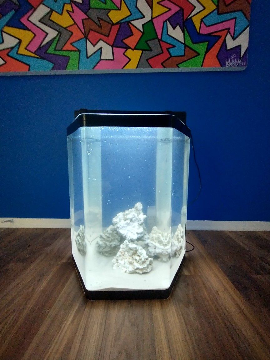 Acrylic 35 Gallon Hexagon Tank. Comes with light sand & rocks. 23"H x 21"W x 21"L