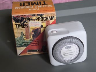 vintage intermatic TN811C programmable timer features a white body and a 24-hour dial for controlling lamps and https://offerup.com/redirect/?o=YXBwbG