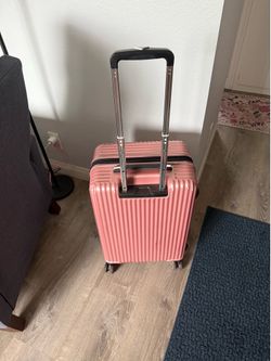 Pink Suitcase with swivel wheels