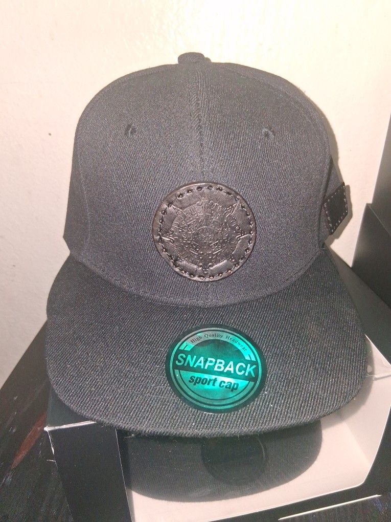 A Snapback Hat Black On Black With A Hand Pressed Aztec Calendar With Authentic Leather
