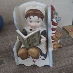 Ceramic girl reading Bible musical