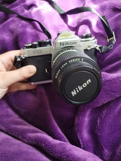 Nikon FE2 35mm film SLR camera and accessories