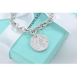 TIFFANY & CO. Sterling Silver New York Stamped Wavy Tag Charm Bracelet 