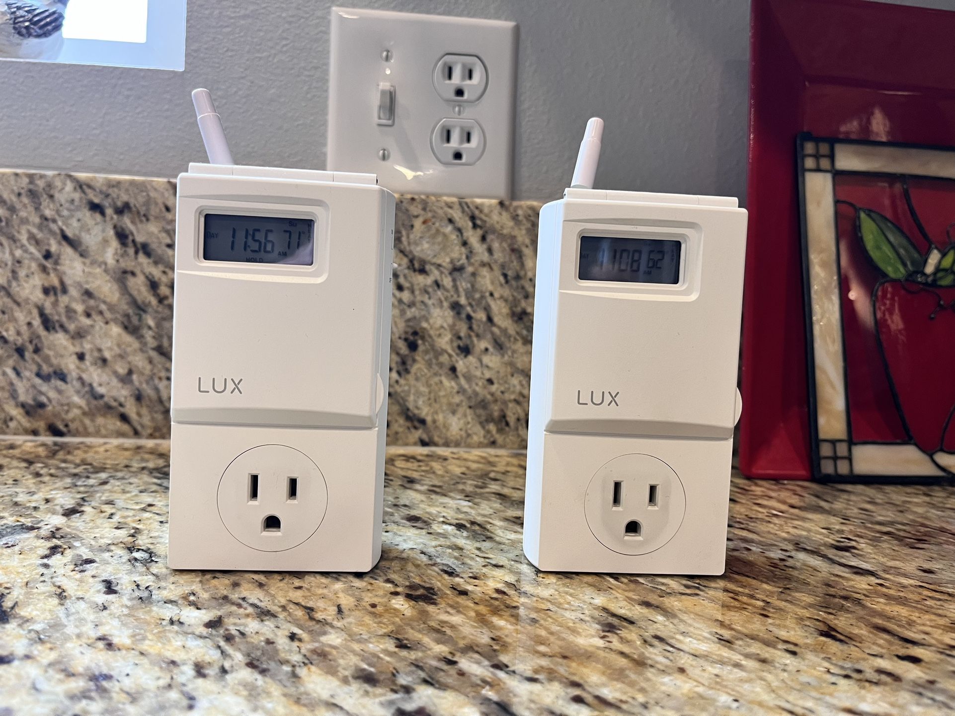 Two LUX WIN100 Series Thermostats
