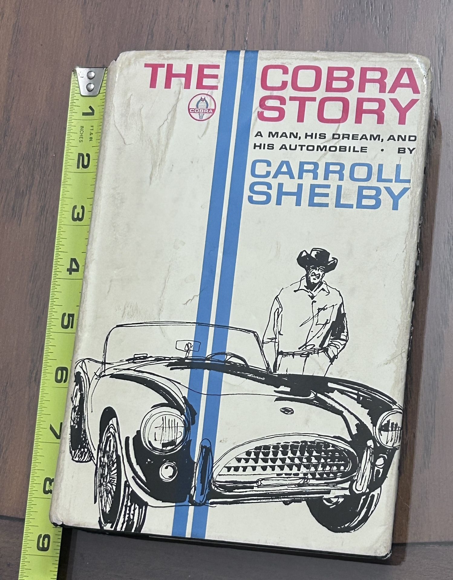 Carroll Shelby signed 1965 Cobra Story book AND rare Cobra English key fob!