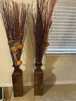 Pair of decorative floor vases with natural sticks and accents.