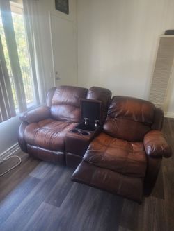 Brown leather reclining couch set