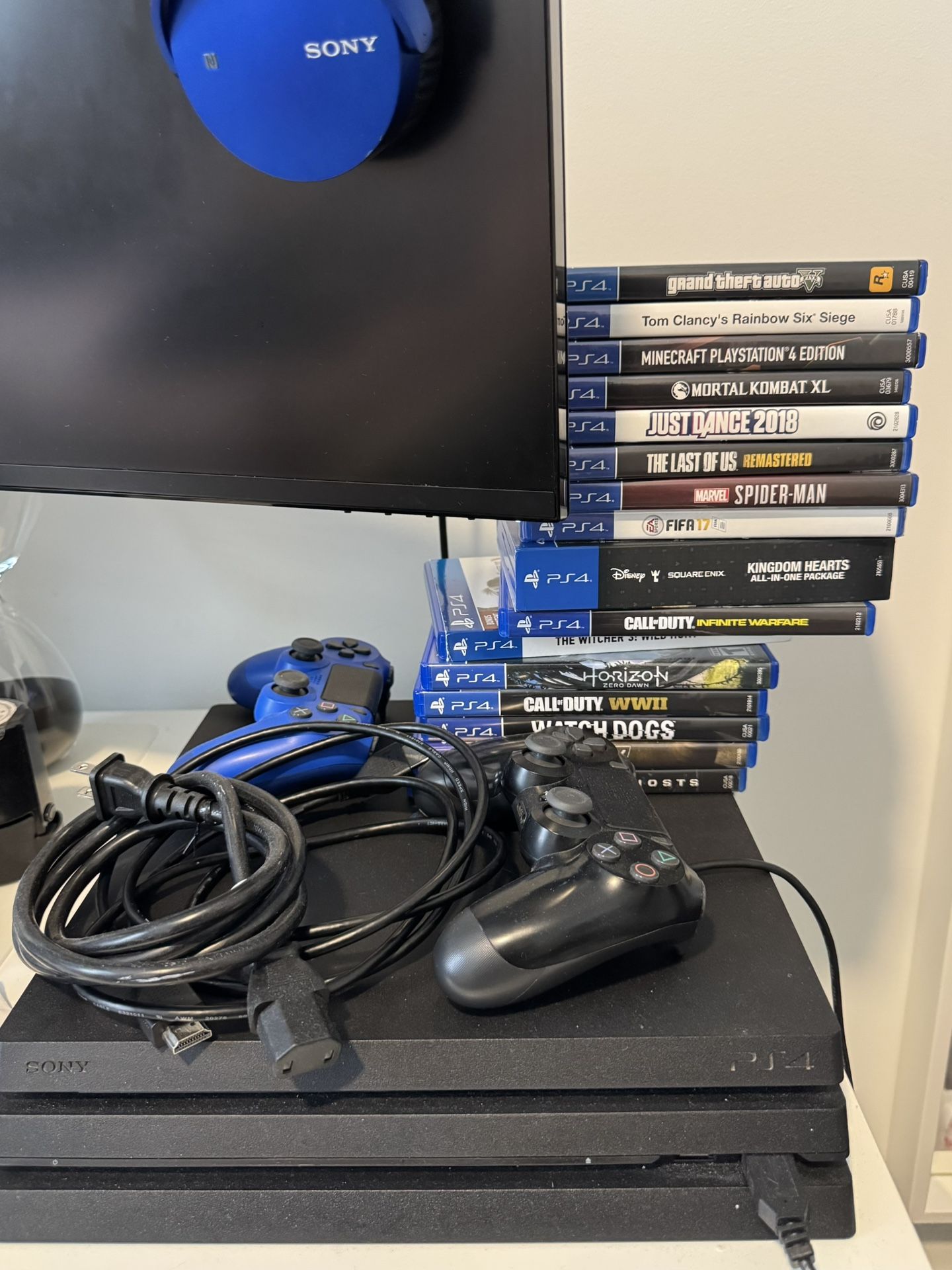 PlayStation 4 Pro Bundle – Dual Controllers + 15 Games (Excellent Condition)