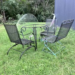 Four chairs and table with glass