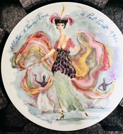 This is a 1976 D'Arceau-Limoges collector plate from the "Les Femmes du Siècle" (Women of the Century) series, designed by artist François Ganeau