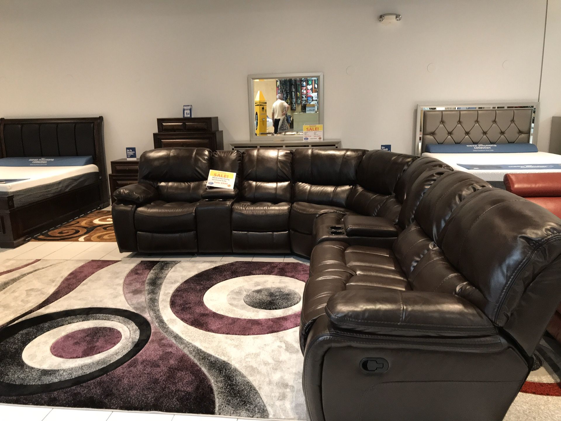 COMFY NEW MADRID MANUAL RECLINING SECTIONAL AVAILABLE IN BROWN$999 AND GRAY$1099. ADD ON NEW DESIGN AREA RUGS $149! DOORBUSTER SALE EVENT! SAME DAY D