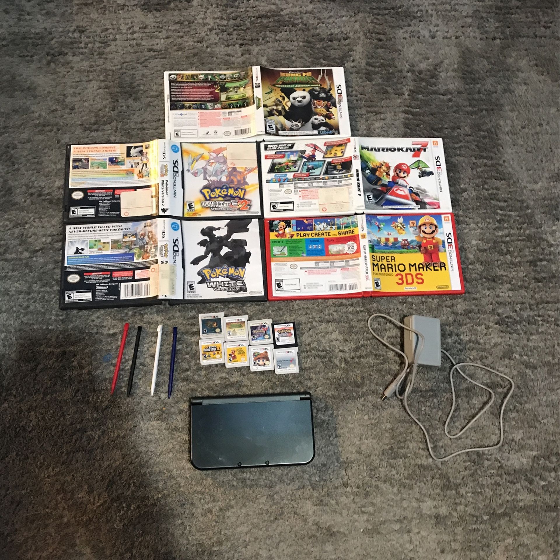 Nintendo 3ds Xl Gray. Comes With 8 Games 4 Stylus Pens Charger And Five Cases.