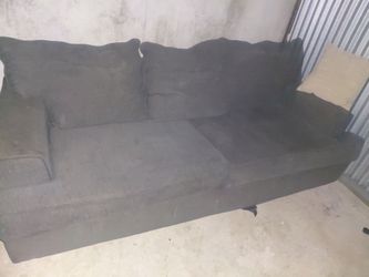 Blue couch with cushions