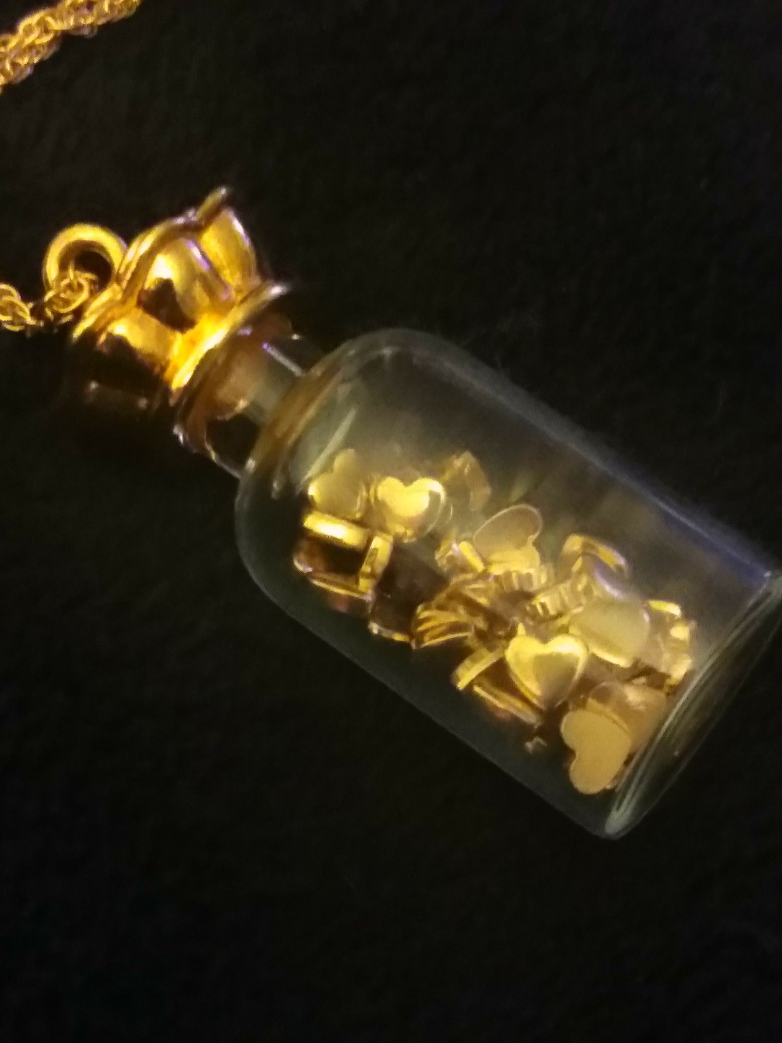 Vintage bottle of gold hearts