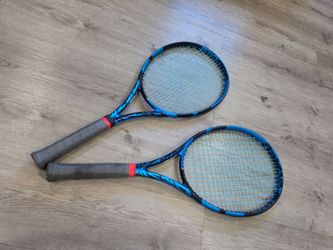 Two Babolat Pure Drive Tour racquets, grip 4 3/8. Size 3.