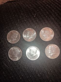 Six Kennedy Half Dollars. 