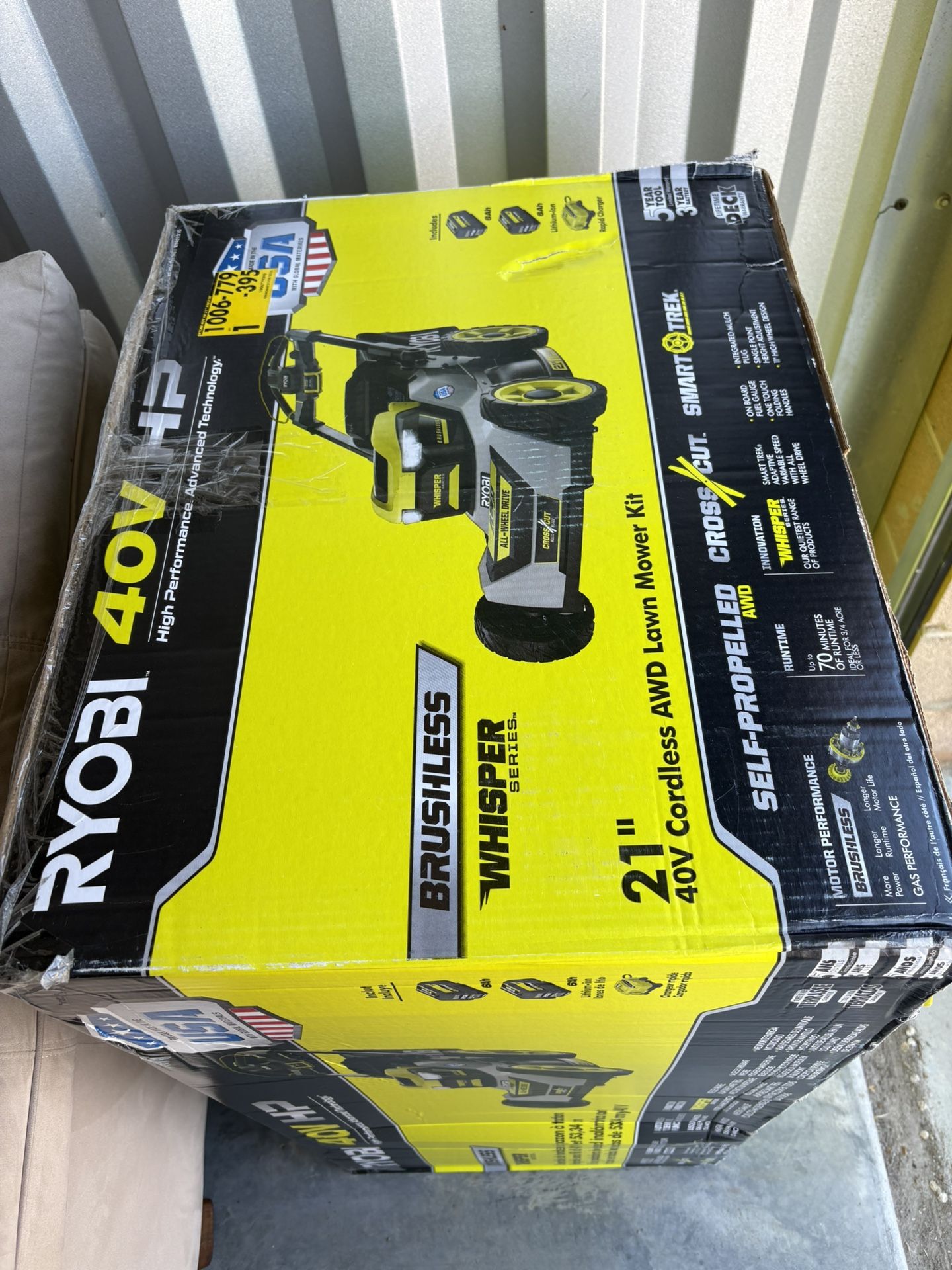 Brand new 21” Ryobi brushless crosscut blades electric lawn mower with 2 6Ah lithium ion batteries and Rapid charger