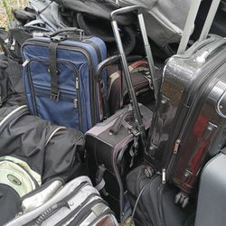 LOTS OF NICE PULL ALONG LUGGAGE 