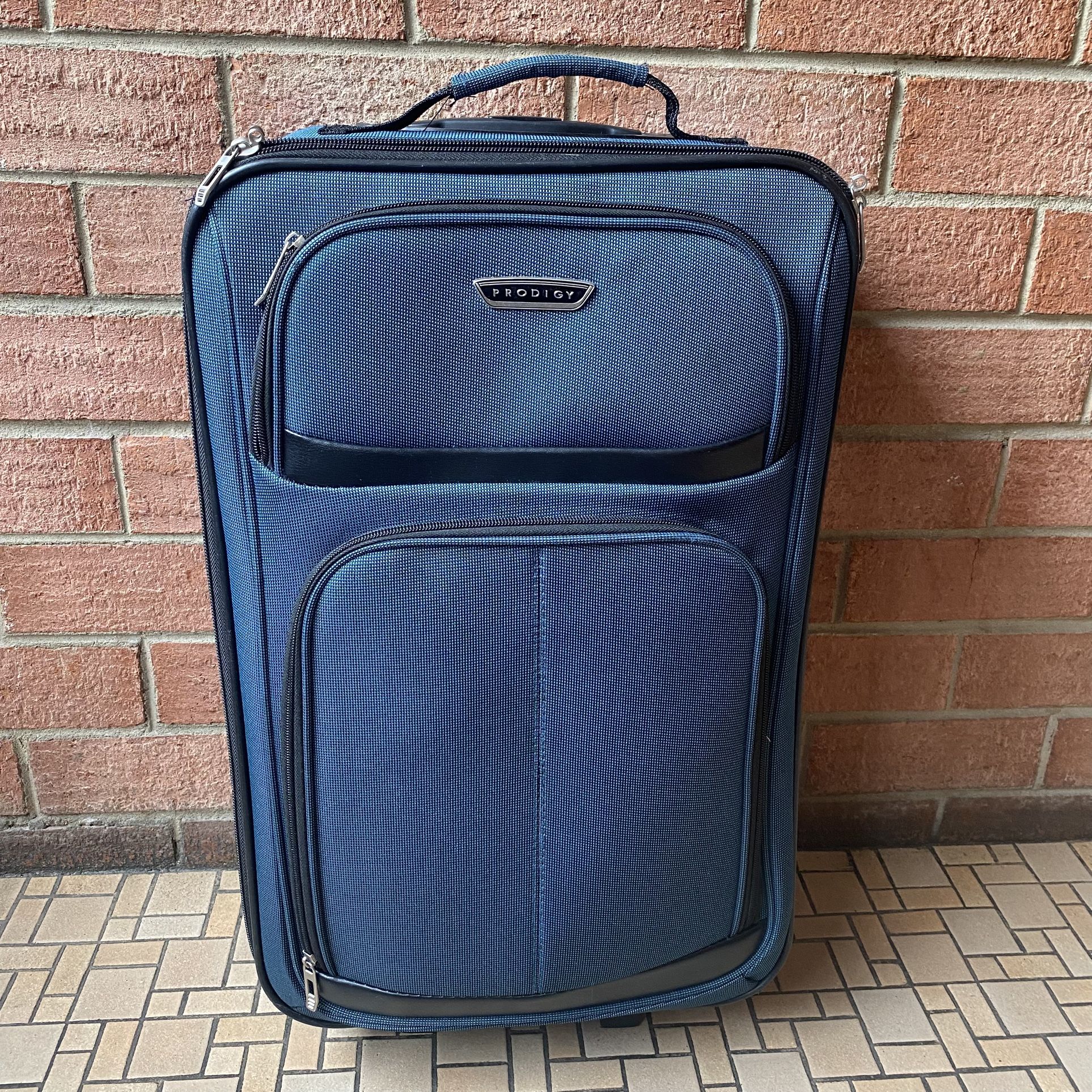 Blue 24” PRODIGY Carry-On Luggage Suitcase Travel Bag Good pre-owned condition. Measurements: 24” Tall x 14” Wide x 8” Deep Pick up available in