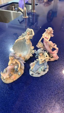 Collectible blue/purple mermaid figurines