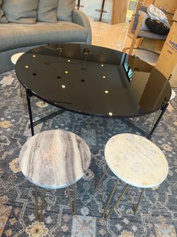 Beautiful black coffee table. With 6 marble support!