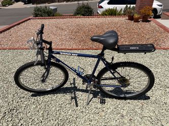 Outfitters 2500 MTi 18-Speed Mountain Bike w/ Gel Seat & Cargo Rack - $150