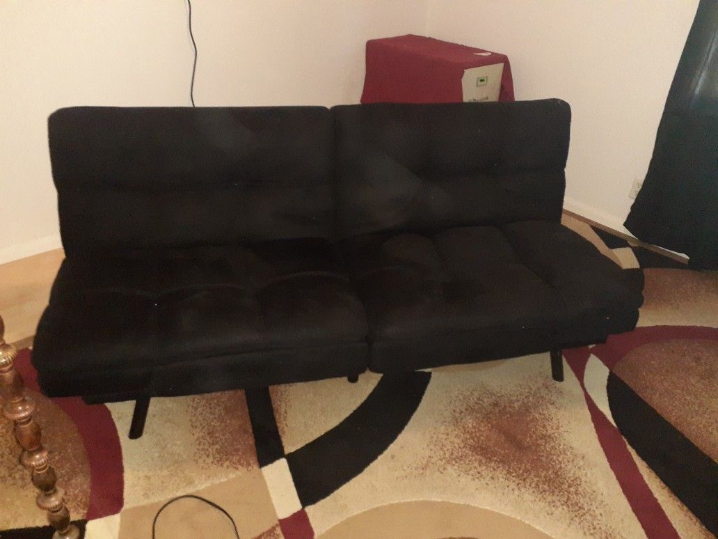 Newer twin size futon. Barely used, non smoker, non ill person