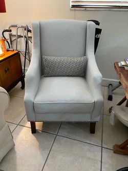 Light Gray Wingback Accent Chair with Nailhead Trim