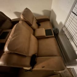 Almost New Vibrating Couches With Built In Speakers And Wireless Phone Charging With Storage  Compartments 