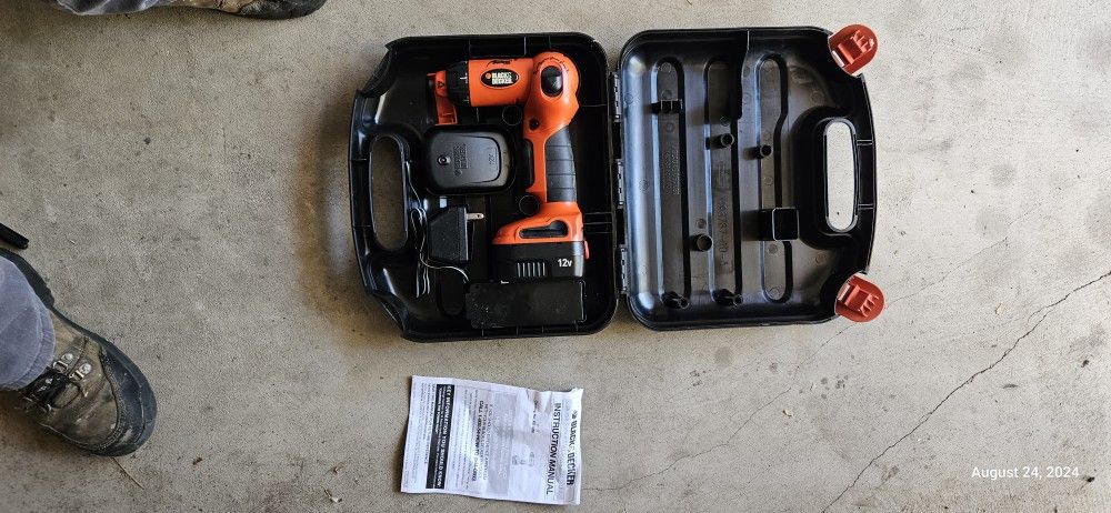 Black and Decker, 12 volt, cordless, swivel drill driver and battery.