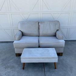 Light Grey Loveseat And Ottoman