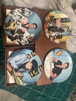Elvis Presley looking at a legend 11 piece collectible set on China with paperwork and authenticity