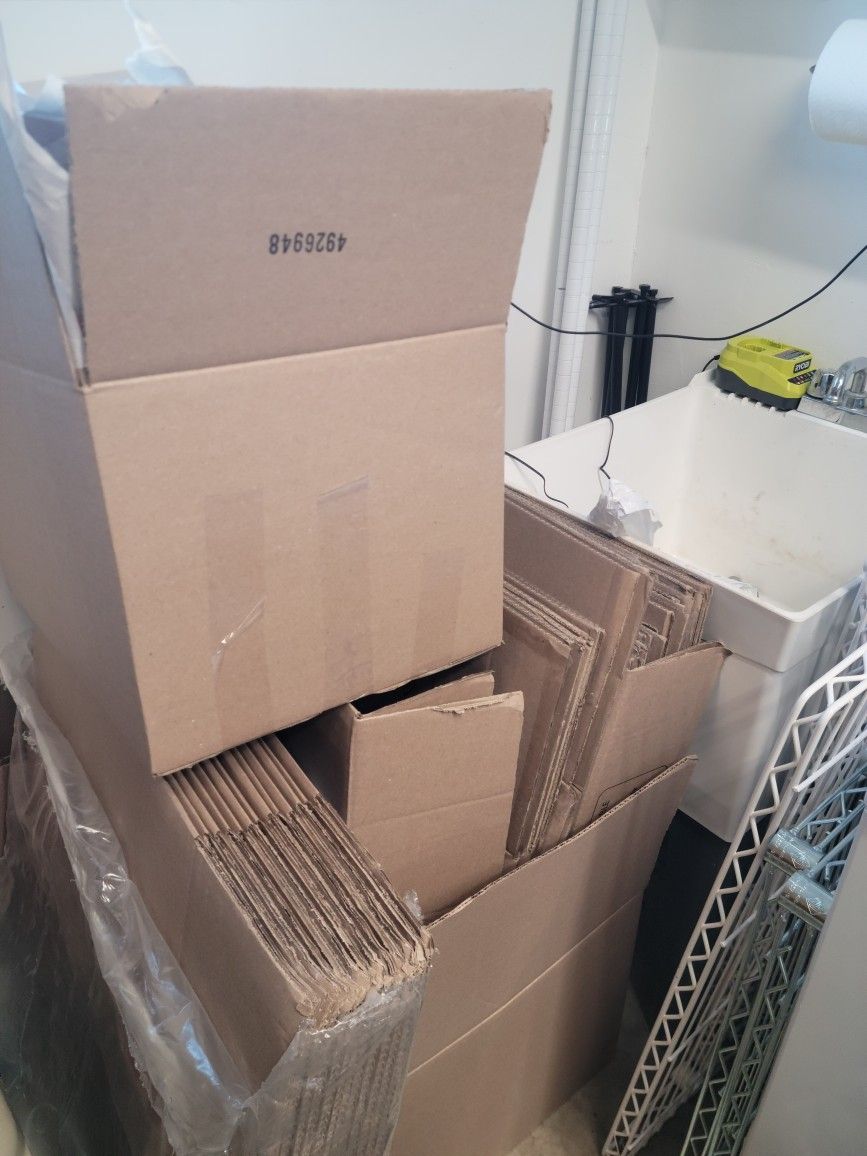 Medium And Small Moving Boxes And Moving Paper