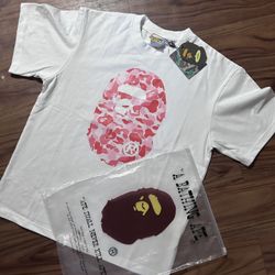 white and pink bape shirt