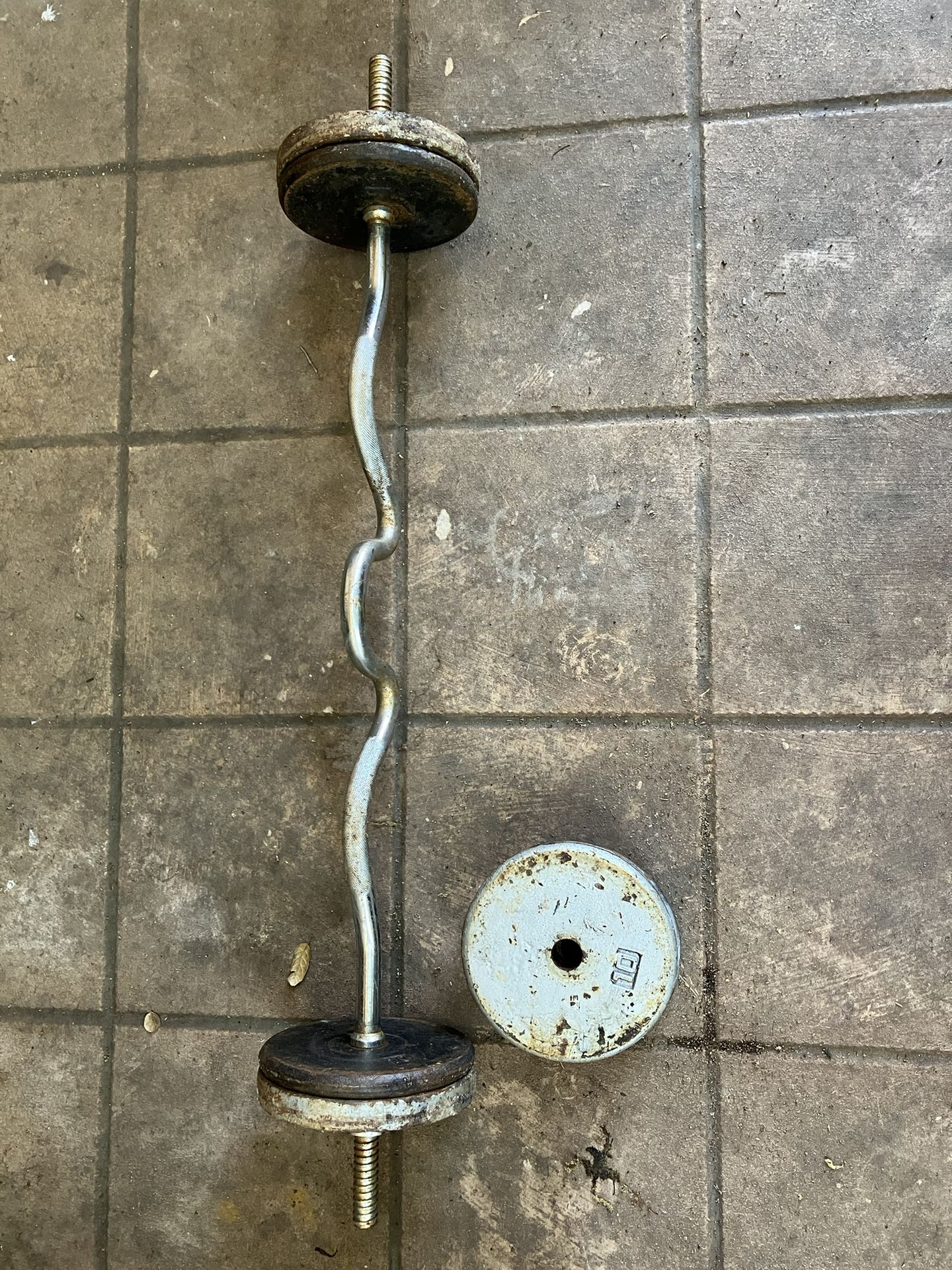 Selling Rugged Iron Curling Bar With 80 Pounds Of Weights 