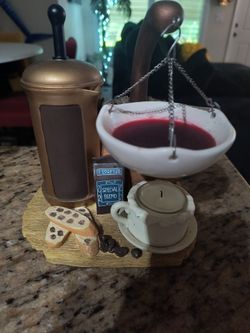 This is a Yankee Candle Hanging Coffee Press wax tart burner.