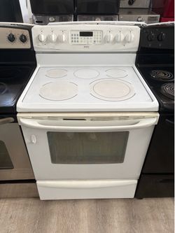All white Kenmore electric stove