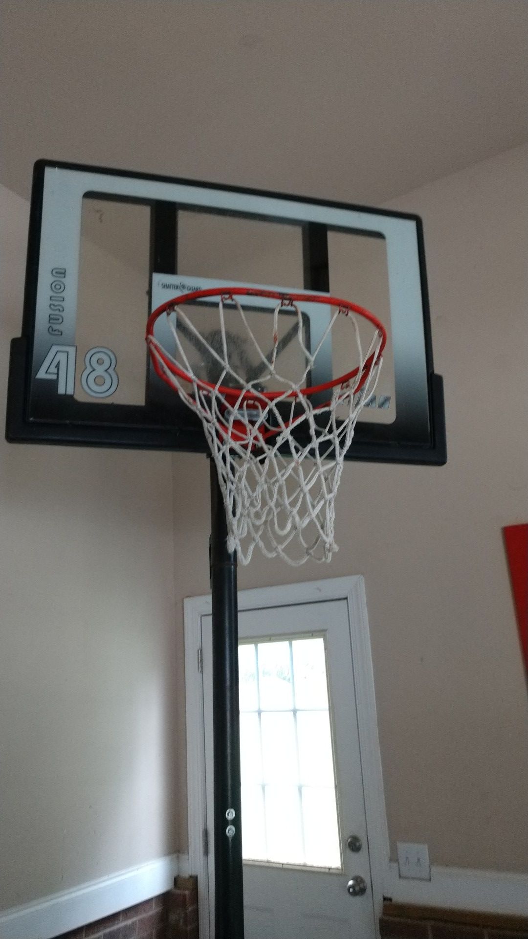 Adjustable basketball hoop