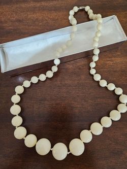 Costume  with graduated ivory beads 28", like new $5.00