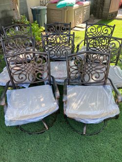 Outdoor rocking and swivel chairs beautiful bronze finish with tan cushions NEW in box