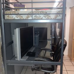 Twin bunk bed with desk