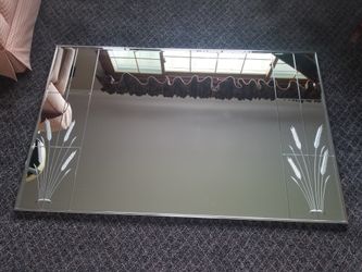 Beautiful heavy Mirror with etchings on each side.