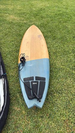 Surfboard and travel bag5-fin setup, this is a Firewire ADDvance TimberTEK, specifically the Surfrider Foundation collaboration. Pro-Lite Internationa