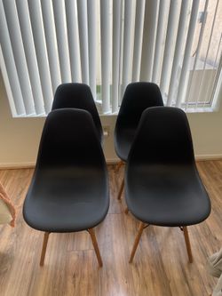 Black “Eames” mid-century modern dining chairs (4)