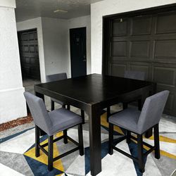 Large solid wood dining table set with 4 chairs