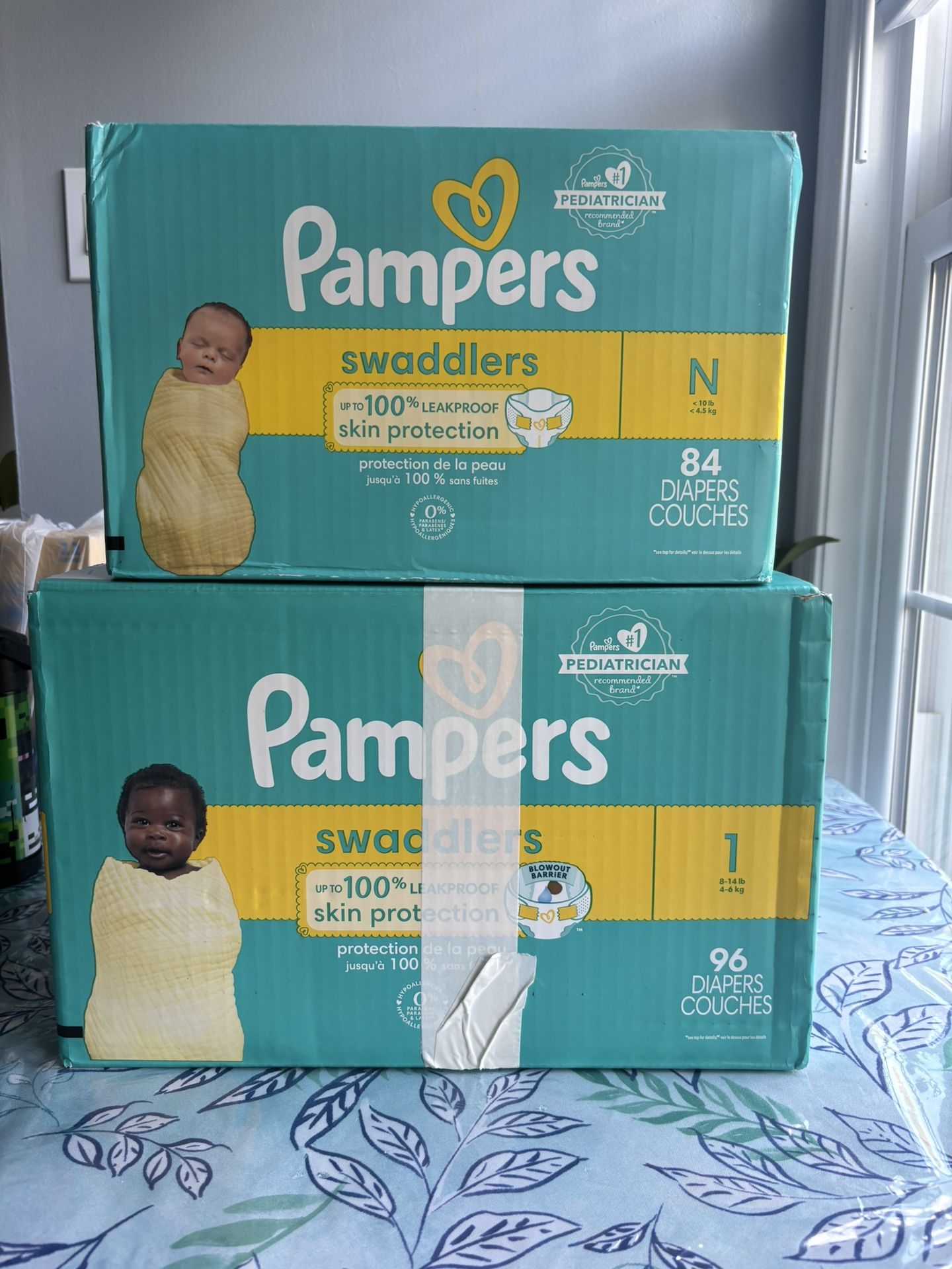 Swaddlers Diapers newborn and Size 1