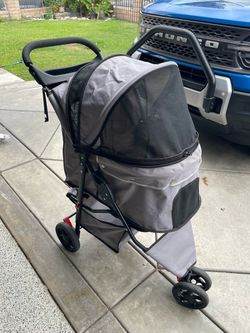Small pet stroller for a dog or cat