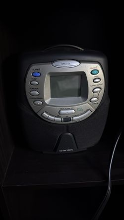 This is an Audiovox CD player AM/FM clock radio, likely model CD1180. 