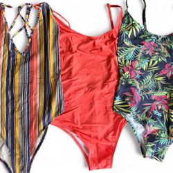 Set of 3 Multi-coloured one-piece swimsuits, each with a unique design #swimwear