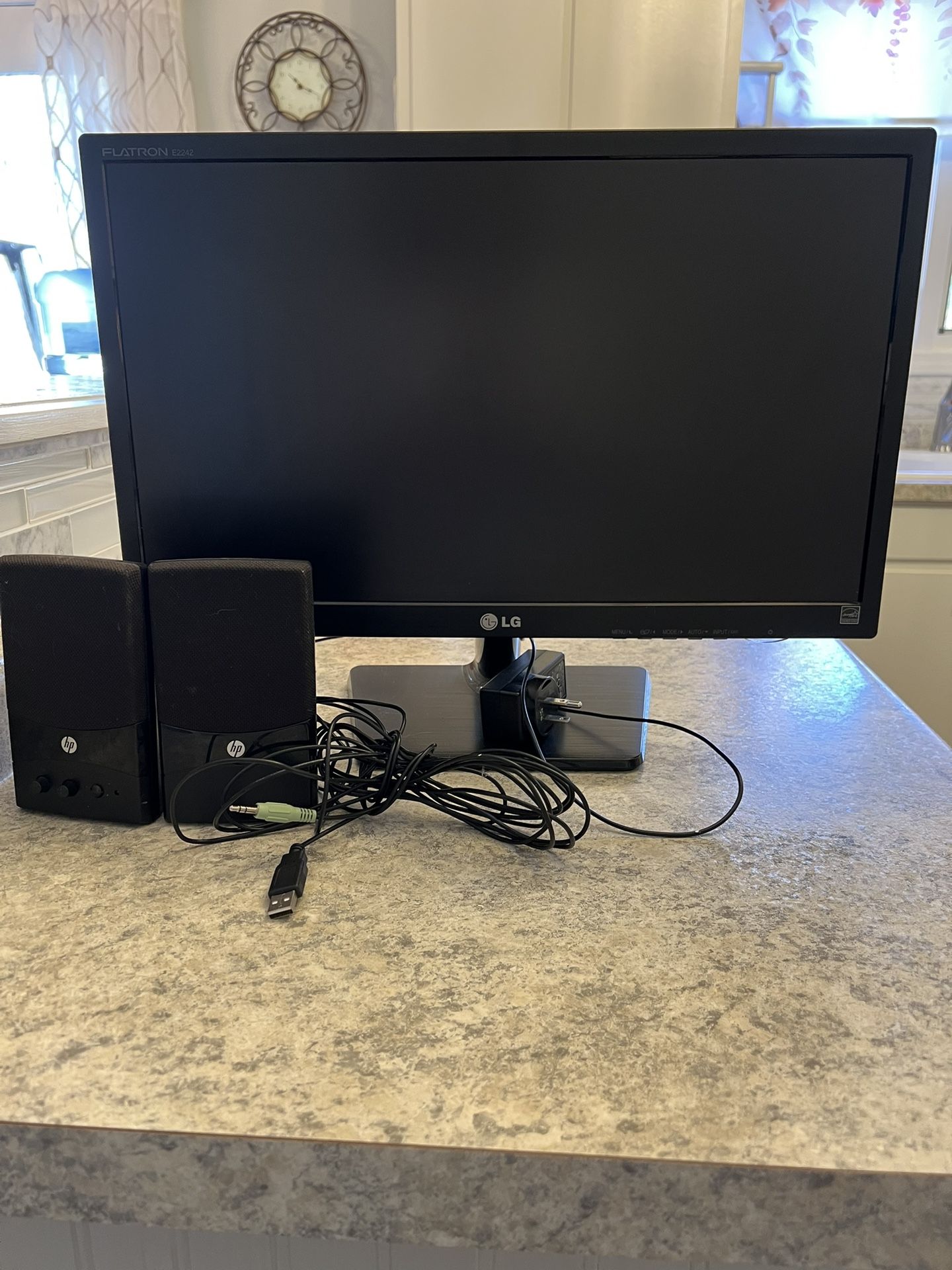 Computer Monitor And Wired Speakers.